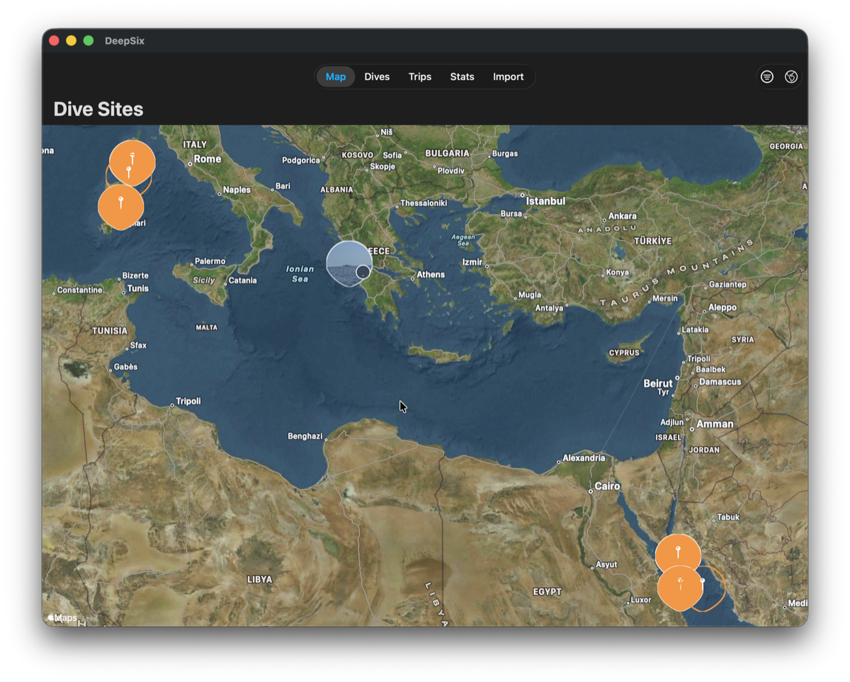 Global dive map showing planned trips alongside logged dives — Sardinia cluster, Southern Red Sea sites, and gray approximate-location circle over the Ionian Sea